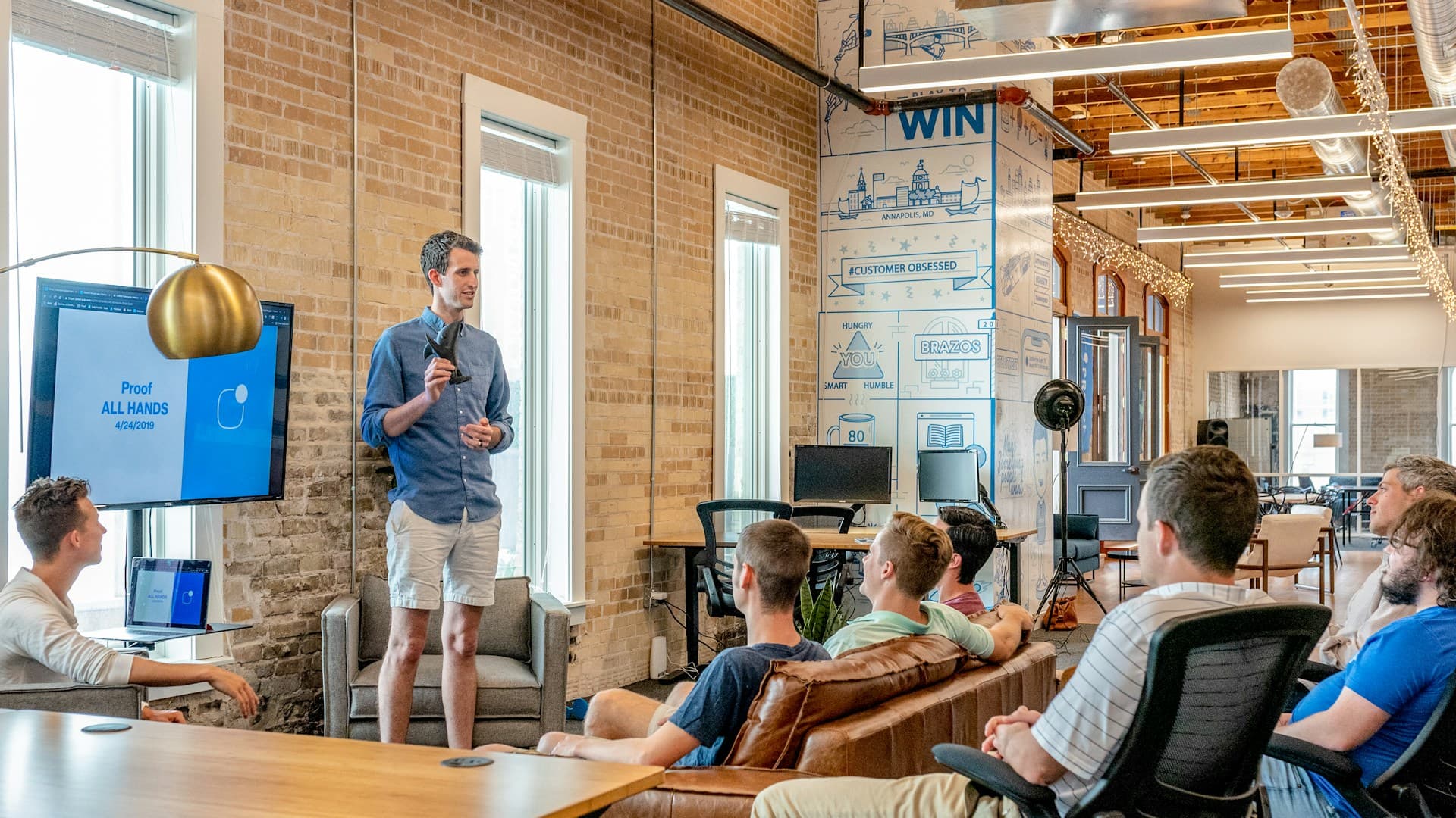 Team celebrating progress and results in a modern workplace