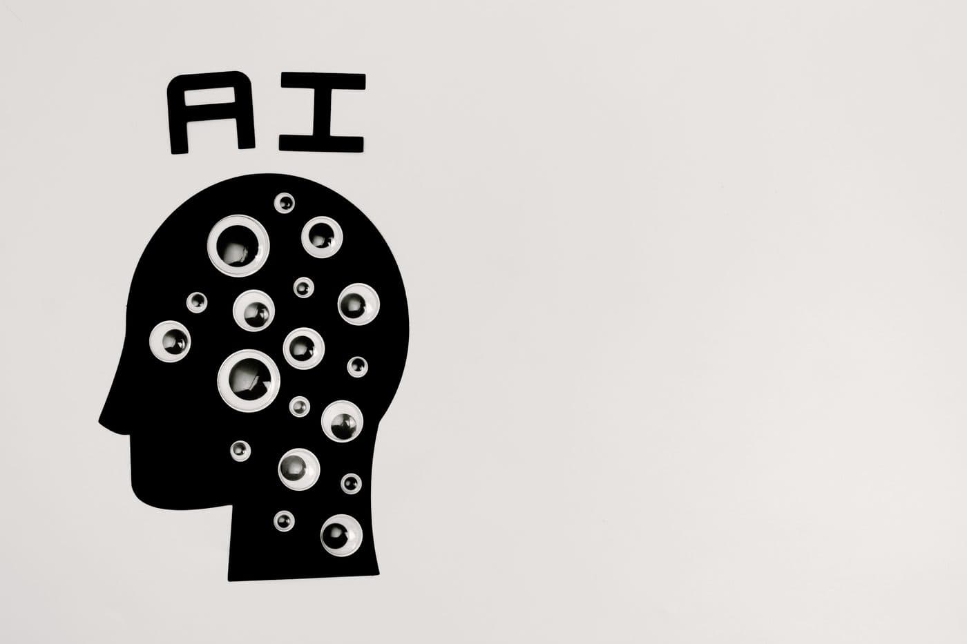 A minimalist paper cutout of a head filled with lenses beside the letters AI, representing machine learning